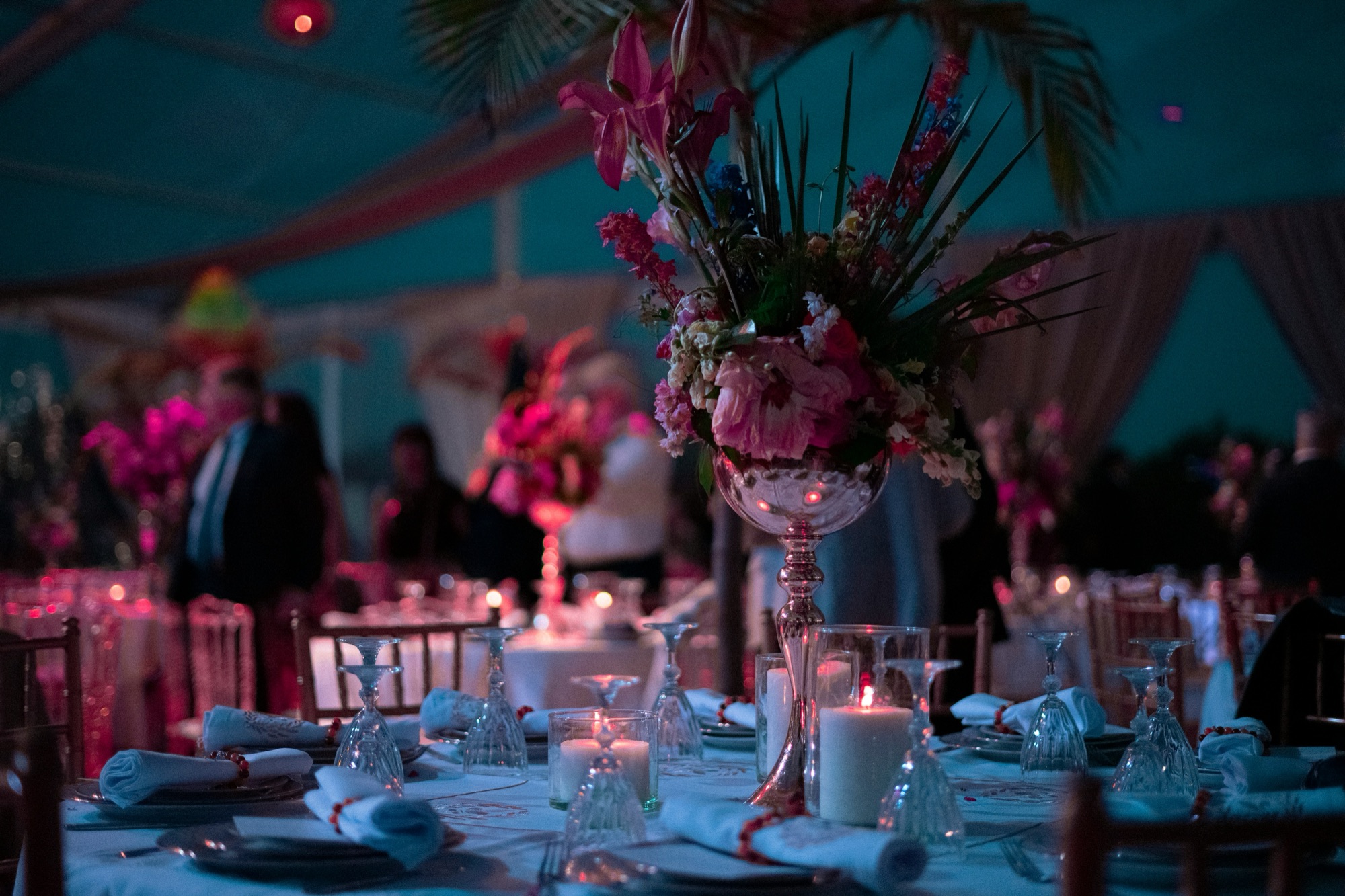 A banquet table with flowers and candles